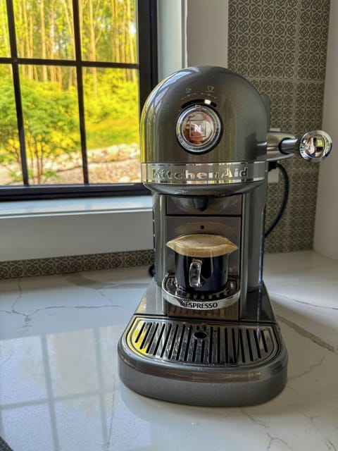 Sip rich espresso with nature views—all from the comfort of your stay. ☕️