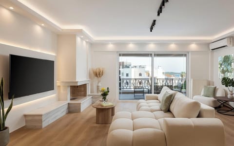 Deluxe Apartment, Balcony, Sea View | Living room | 65-inch Smart TV with digital channels, Netflix, streaming services