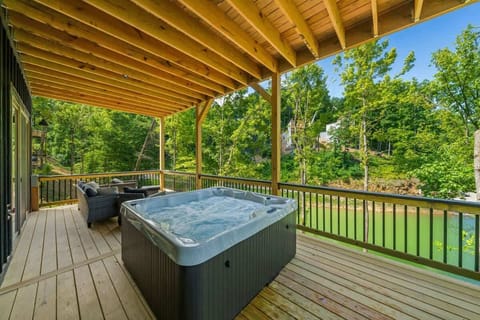 Private hot tub located on the lowest level deck. 