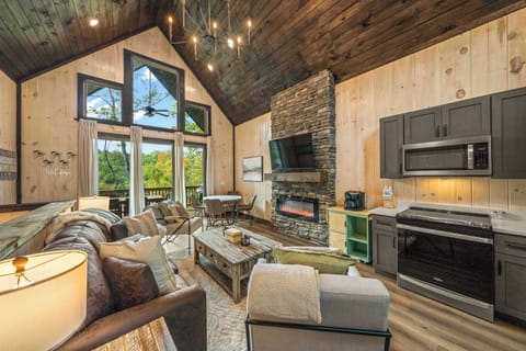 Open main level floor plan with living, dining, and kitchen.