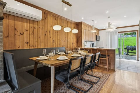 A custom banquette and long dining table easily fits your whole group for memorable meals and game nights!