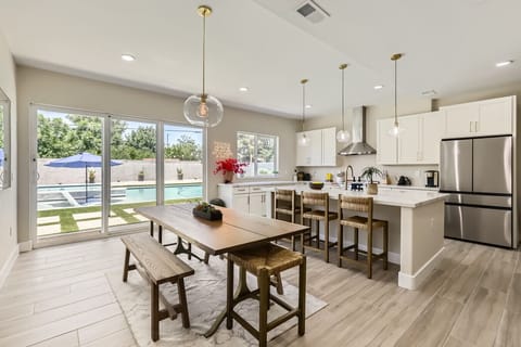 Kitchen and dining with pool views