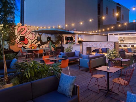 Colorful outdoor patio with string lights and lounge seating