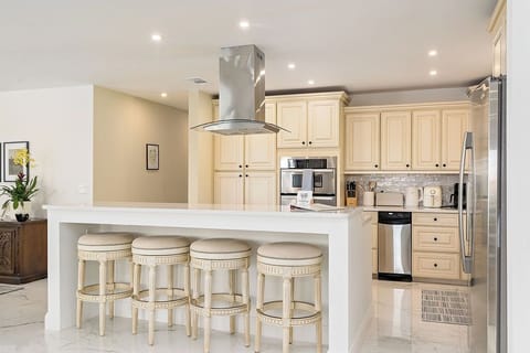 Family can gather at the island for conversation while dinner is being made