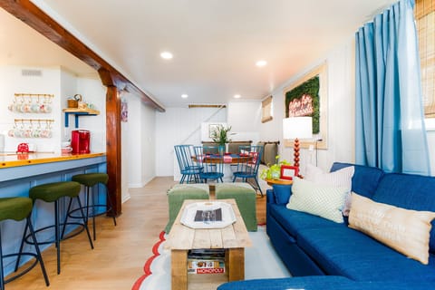 Downstairs living room flows into the kitchen, looks at the lake.