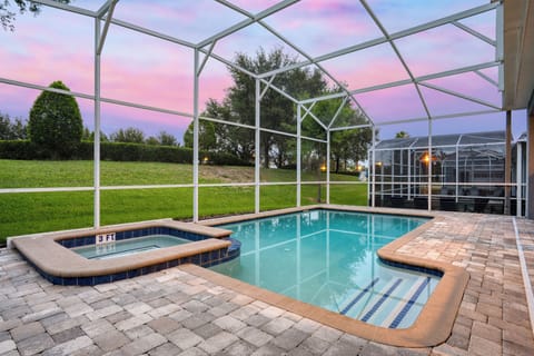 Pool at dusk—unwind with a serene swim as the sun sets and the sky glows.