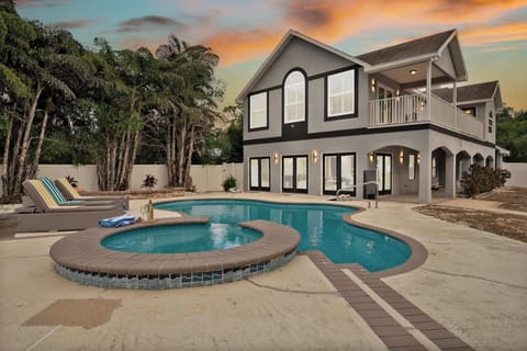 Your private Tampa oasis awaits! Dive into relaxation with your own sparkling pool and soothing spa, perfect for enjoying those stunning Florida sunsets.