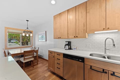 Updated kitchen featuring stainless steel appliances.