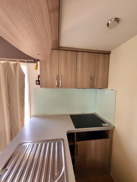 Mini-fridge, stovetop, espresso maker, coffee/tea maker