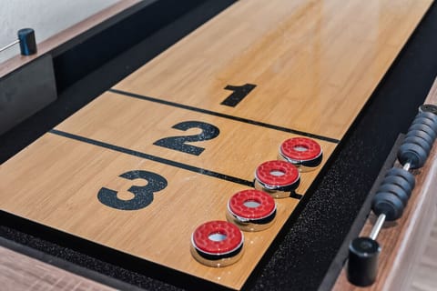 Bring your competitive spirit! The shuffleboard table is ready for action, offering hours of indoor amusement for guests who love to play, strategize, or simply enjoy the thrill of sliding pucks across a smooth, polished board.
