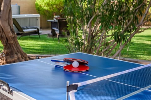 Ping Pong Paradise.Enjoy outdoor fun with friends and family on this vibrant ping pong table.