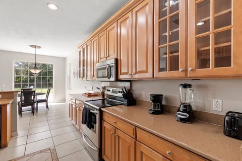 Kitchen | Fully equipped with stainless steel appliances, ample cabinetry, and countertop space