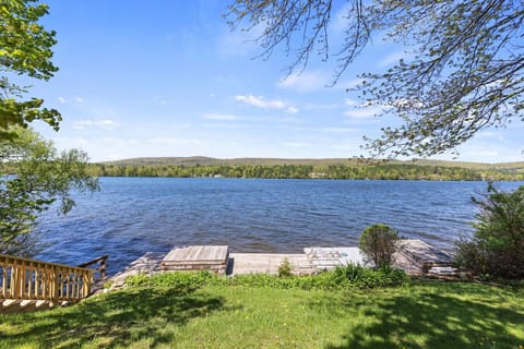 Private lakefront access with a dock, perfect for swimming, fishing, or simply enjoying the view.