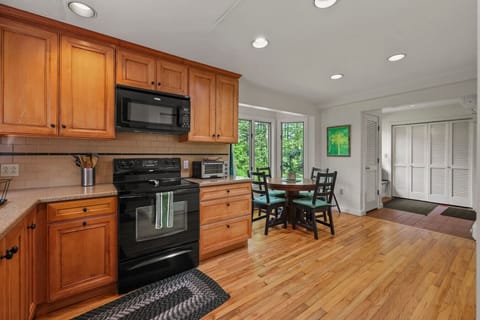 Ample counter space and fully stocked cabinets with essentials perfect for home-cooked meals or takeout nights.