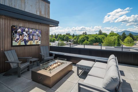 Outdoor TV, fire table and lounge area.