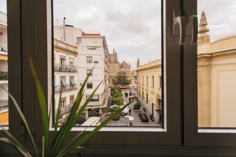 Apartment, City View | Living area | Flat-screen TV