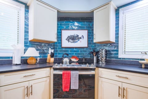 There is an electric range in the kitchen.