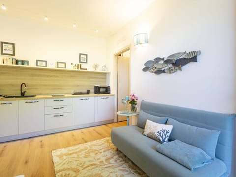 Furniture, Interior Design, Flooring, Floor, Wood, Room, Couch, Ceiling, Lighting, Textile