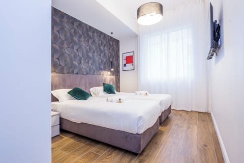 Apartment, 3 Bedrooms, 2 Bathrooms | Laptop workspace, iron/ironing board, free WiFi, bed sheets