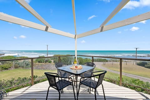 Start the morning on the balcony with coffee in hand, watching waves roll across Middleton Point.