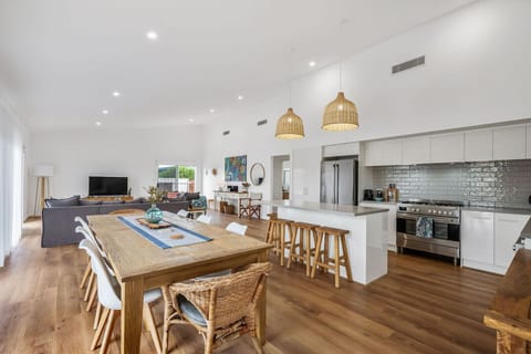 Open dining area seamlessly blends with the kitchen and living zones.