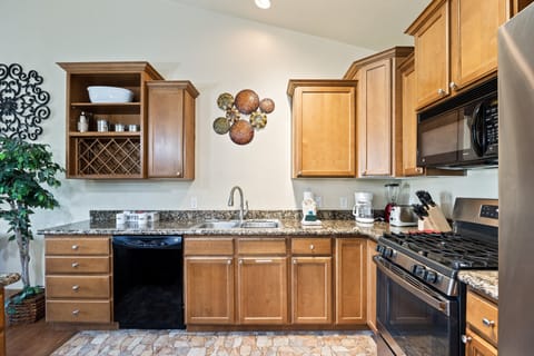 - Full kitchen with modern appliances and granite countertops  
- Ample cabinets and wine storage for extended stays  
- Perfect for preparing meals and enjoying with family