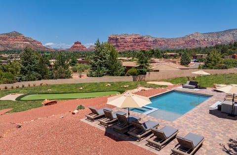 [Resort Property] Backyard heated pool and spa with putting green