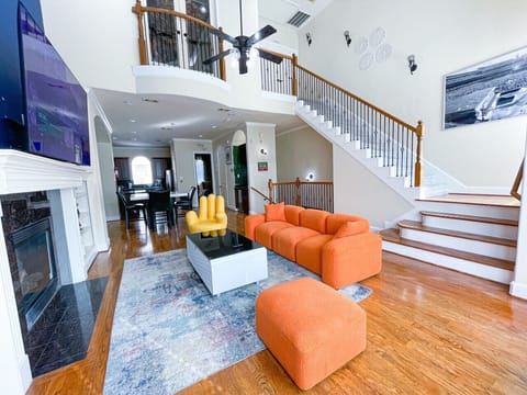 Our spacious living room features bold, creative furniture, a 75” Roku TV, and vibrant decor—perfect for relaxing or capturing Insta-worthy moments. Book your stay for an immersive getaway!