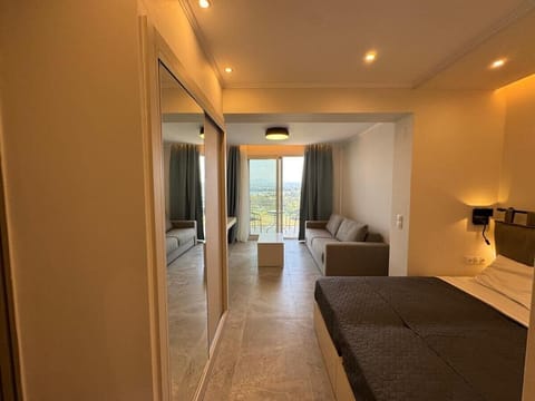 Junior Suite, Balcony, Sea View | Desk, laptop workspace, blackout drapes, iron/ironing board