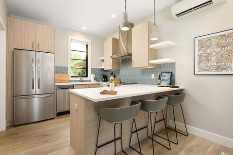 Enjoy the convenience of a fully equipped kitchen designed with contemporary flair. Stainless steel appliances, elegant cabinetry, and generous counter space make meal prep a breeze.