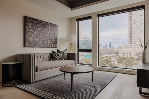 Bright and modern living room with city views

