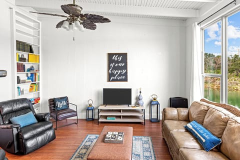 Relax in the bright and spacious living room with excellent lake views!