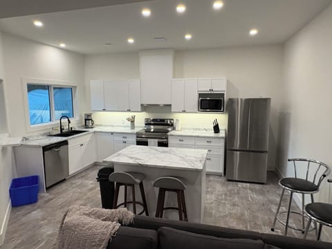 Open, updated kitchen with full sized appliances. 