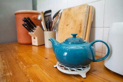 Kitchen with chopping boards and cooking utensils