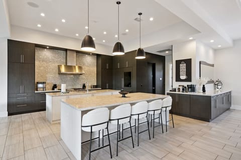 Chef's Kitchen with dual oven and range, dual microwave, dual dishwasher oversized refrigerator, pantry and ample storage