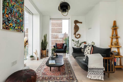 Bright and inviting living area with beautiful decor and abundant natural light, creating the perfect space to relax and unwind