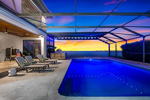 Outdoor Oasis: Dive into relaxation by the sparkling pool, sunset views!
