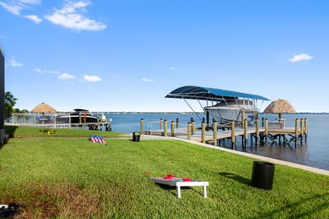 Relax on lush lawns and enjoy sunset views from your private dock!

