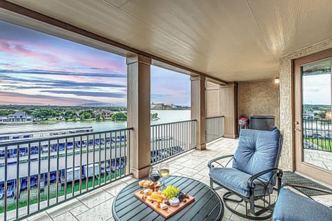 Savor sunset views over the marina from your private balcony retreat.
