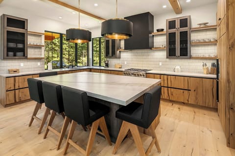 Grand Mountain Estate. - Fully stocked chef's kitchen with seating for 5 around the oversized island.