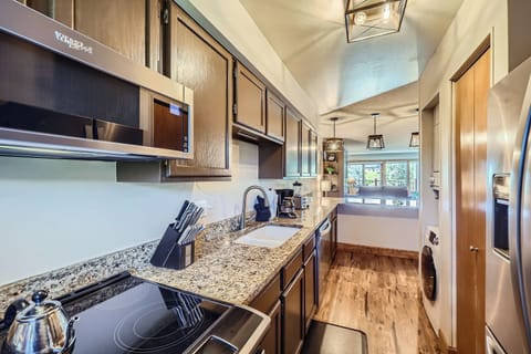 Fully equipped galley-style kitchen with granite countertops, modern appliances, and everything you need to cook and dine in comfort.