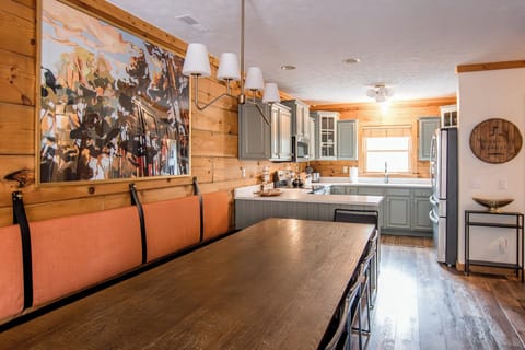 The kitchen opens into the large dining area.