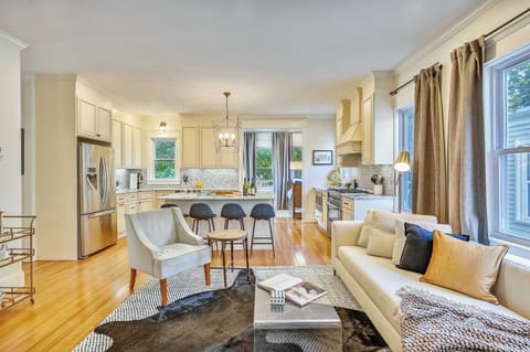 Unit 4 | Open Concept Living Room | XL Flat Screen TV | Hardwood Floors | Fourth Floor
