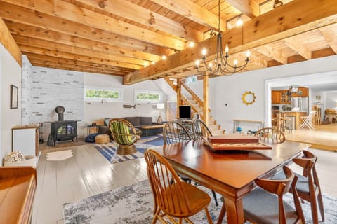 Seating available for family dinners at the kitchen island, high-top table and the dining table connected to the living room.