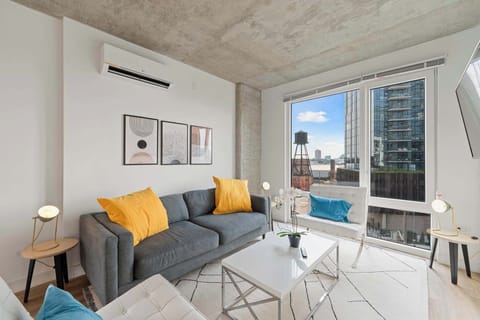 Living room, coffee table, sitting area, bright room, in-room AC