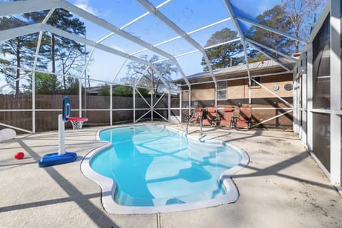 This sparkling, screened-in pool is perfect for year-round fun, whether you're shooting hoops with the poolside basketball set or just soaking up the Georgia sun.