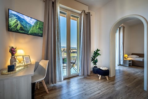 Family Suite, Balcony, City View | In-room safe, desk, laptop workspace, soundproofing