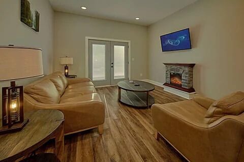 Spacious Living Room with Electric Fireplace and SMART TV with Cable & WIFI throughout vacation rental