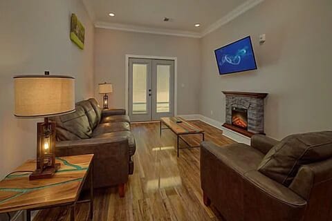 Spacious Living Room with Electric Fireplace and SMART TV with Cable & WIFI throughout vacation rental