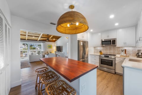 Large butcher block island seats 4. Kitchen has everything you need for cooking!